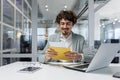 Mature businessman happy with good news received letter in envelope, senior man with beard reading and smiling working Royalty Free Stock Photo