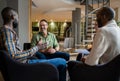 Mature businessman laughing during a meeting with coworkers