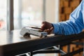 Mature businessman paying with contactless credit card with NFC technology. Royalty Free Stock Photo