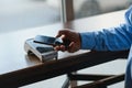 Mature businessman paying with contactless credit card with NFC technology. Royalty Free Stock Photo