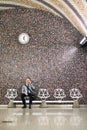 Mature businessman with smartphone in a metro station. Royalty Free Stock Photo