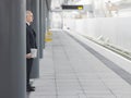 Mature Businessman Waiting At Empty Train Station Royalty Free Stock Photo