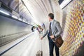 Mature businessman waiting on a metro station. Royalty Free Stock Photo