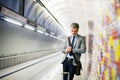 Mature businessman waiting on a metro station. Royalty Free Stock Photo