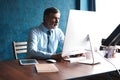 Mature Businessman Working On Computer In Office Royalty Free Stock Photo