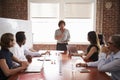 Mature Businesswoman Addressing Boardroom Meeting Royalty Free Stock Photo