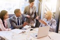 Mature businesswoman conducting a presentation in modern board room Royalty Free Stock Photo