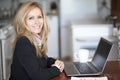 Mature Businesswoman Smiling At The Camera. Working At Home.