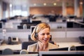 Mature Businesswoman Wearing Telephone Headset Talking To Caller In Customer Services Department Royalty Free Stock Photo