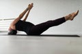 Mature Caucasian woman practicing yoga on livingroom floor Royalty Free Stock Photo