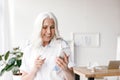 Mature cheerful woman indoors in office Royalty Free Stock Photo