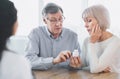 Mature couple asking their doctor about their treatment Royalty Free Stock Photo