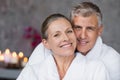 Mature couple in bathrobe at spa Royalty Free Stock Photo