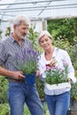 Mature Couple Choosing Plants At Garden Center Royalty Free Stock Photo