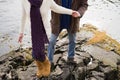 Mature couple climbing rocks