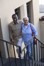 Mature Couple Climbing Stairs