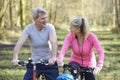 Mature Couple On Cycle Ride In Countryside Together