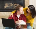 Mature couple displaying pleasure while working from home