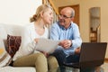 Mature couple with documents and notebook Royalty Free Stock Photo