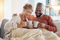 Mature couple, drinking coffee on couch and laughing funny joke in living room of love, care or easy lifestyle together Royalty Free Stock Photo