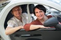 Mature couple driving twizy electric