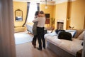 Mature couple embracing in hotel room, back view full length Royalty Free Stock Photo