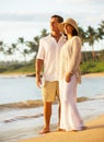 Mature Couple Enjoying Sunset on the Beach Royalty Free Stock Photo