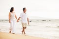 Mature Couple Enjoying Sunset on the Beach Royalty Free Stock Photo