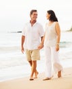 Mature Couple Enjoying Sunset on the Beach Royalty Free Stock Photo