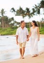 Mature Couple Enjoying Walk on the Beach Royalty Free Stock Photo