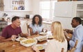 Mature Couple Entertaining Friends At Dinner Party Royalty Free Stock Photo