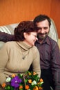 Mature Couple With Flowers Royalty Free Stock Photo