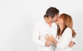 Mature couple giving a kiss during a photo studio session