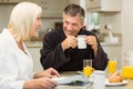 Mature couple having breakfast together Royalty Free Stock Photo