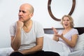 Mature couple having quarrel in bedroom. Royalty Free Stock Photo