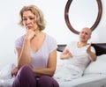 Mature couple having quarrel in bedroom. Royalty Free Stock Photo