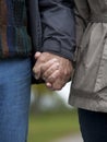 Mature couple holding hands