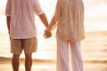 Mature Couple Holding Hands Enjoying at Sunset Royalty Free Stock Photo