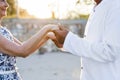 Mature couple holding hands in the sunset Royalty Free Stock Photo