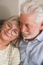 Mature couple at home. Senior man hugging and care aged woman. Having care. Living together elderly lifestyle people in indoor Royalty Free Stock Photo