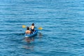 Mature Couple Kayaking in the Blue Mediterranean Sea - Liguria Italy Royalty Free Stock Photo