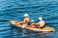 Mature couple kayaking in the blue sea - Liguria Italy Royalty Free Stock Photo