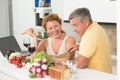 Mature couple in the kitchen Royalty Free Stock Photo