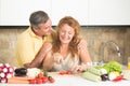 Mature couple in the kitchen Royalty Free Stock Photo