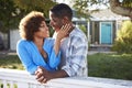 Mature Couple Leaning On Back Yard Fence Royalty Free Stock Photo