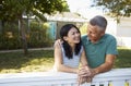 Mature Couple Leaning On Back Yard Fence Royalty Free Stock Photo