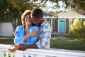 Mature Couple Leaning On Back Yard Fence Royalty Free Stock Photo