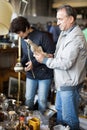 Mature couple is looking old things at the fleamarket Royalty Free Stock Photo