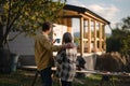 Mature couple looking at their new house under construction, planning future and dreaming. Royalty Free Stock Photo