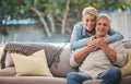 Mature couple, love bond and hug on house patio, home garden sofa and relax furniture chair in backyard. Portrait of Royalty Free Stock Photo